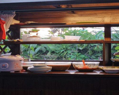 A healthy local Indonesian home-cooked meal on a wooden table